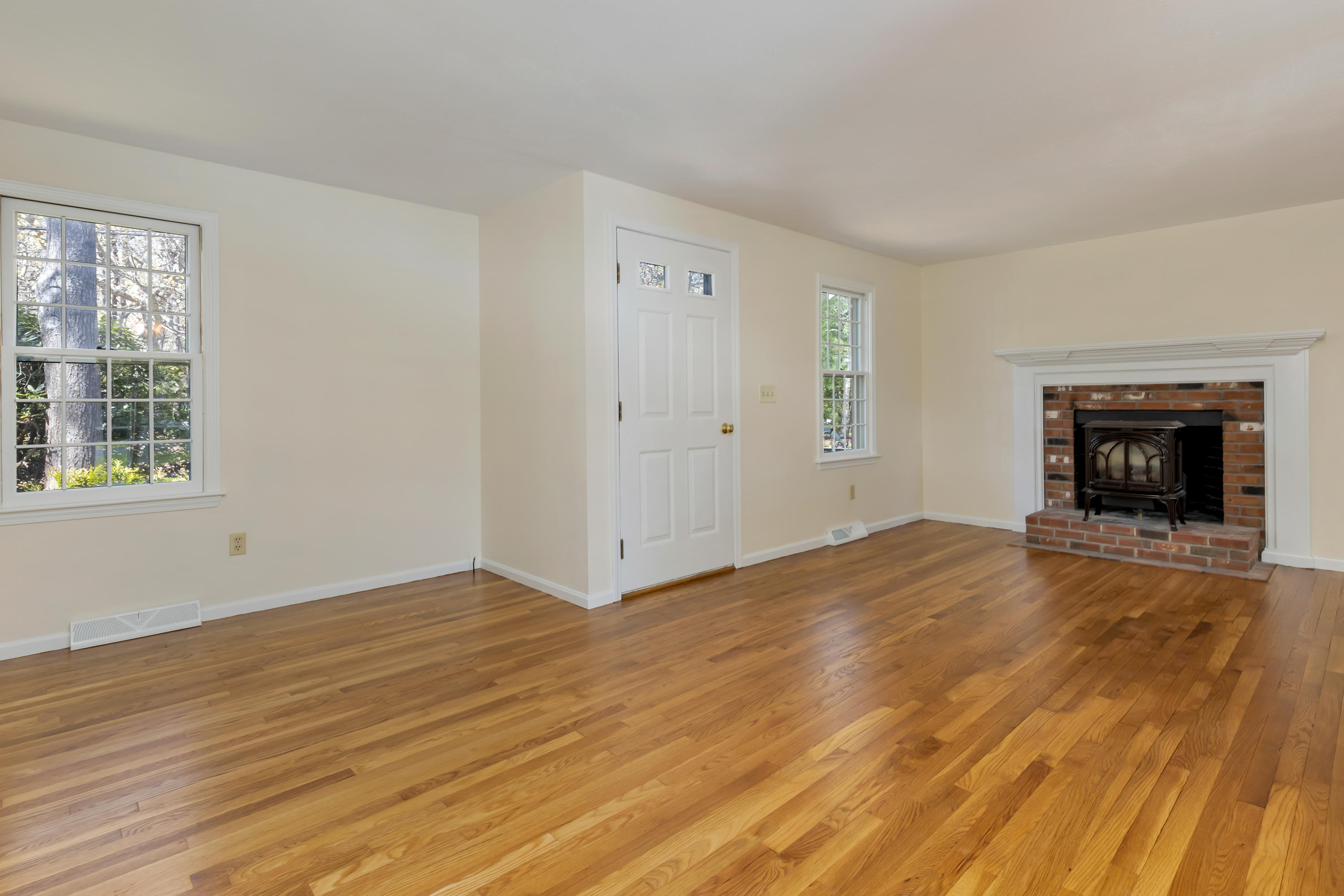 43 Valley Brook Road Centerville, MA 02632 - Photo 8 of 21 a view of empty room with wooden floor and fireplace