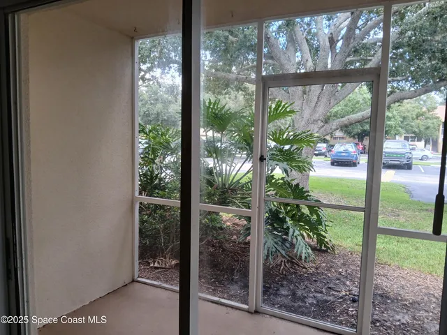 a view of a room with yard from a window