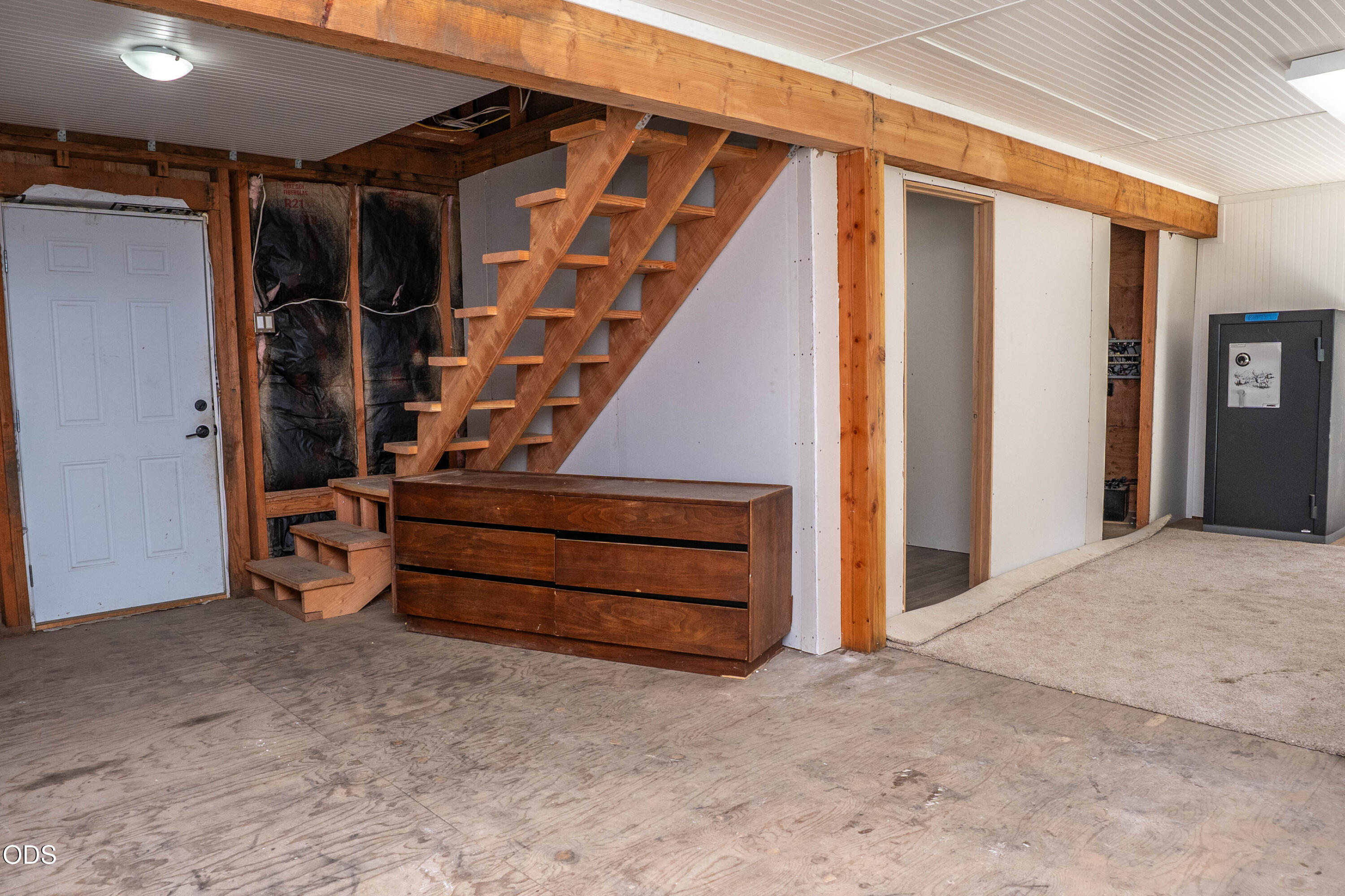 8245 Jumpoff Joe Creek Road Grants Pass, OR 97526 - Photo 18 of 43 a view of an empty room with a staircase