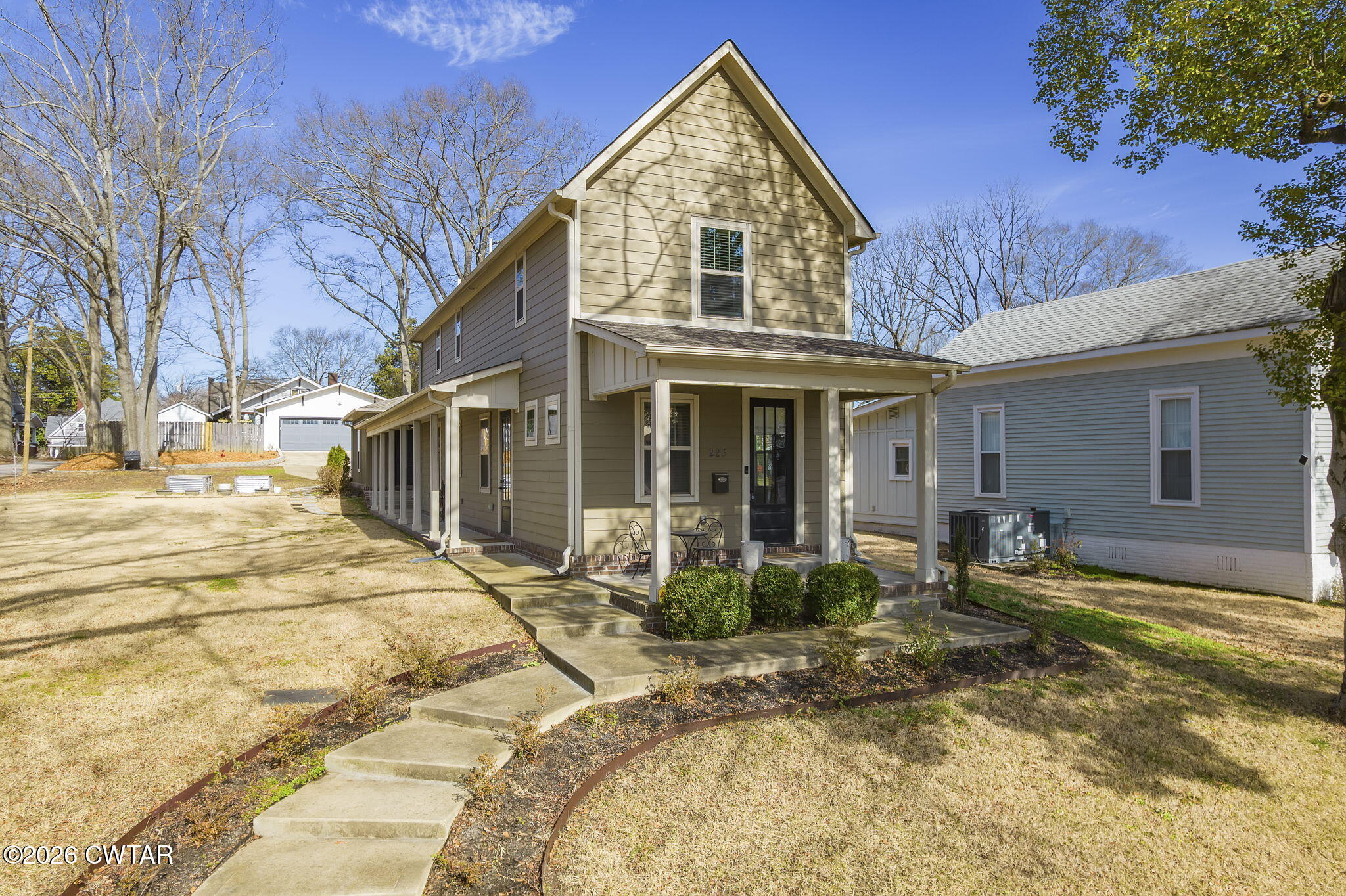 223 Morgan Street Jackson, TN 38301 - Photo 1 of 39 a front view of a house with basket ball court and outdoor seating