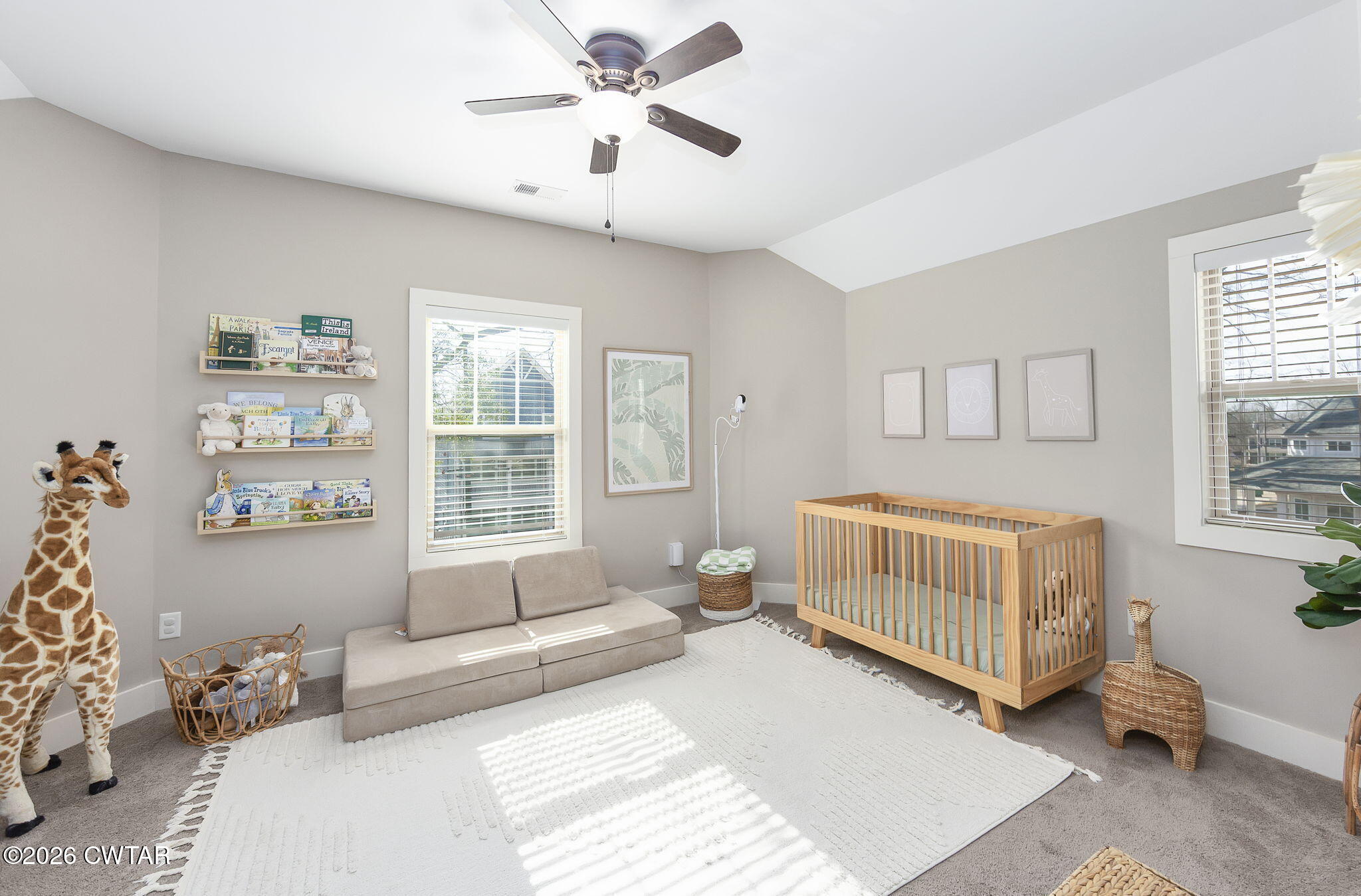 223 Morgan Street Jackson, TN 38301 - Photo 17 of 39 a bedroom with a bed and a couch