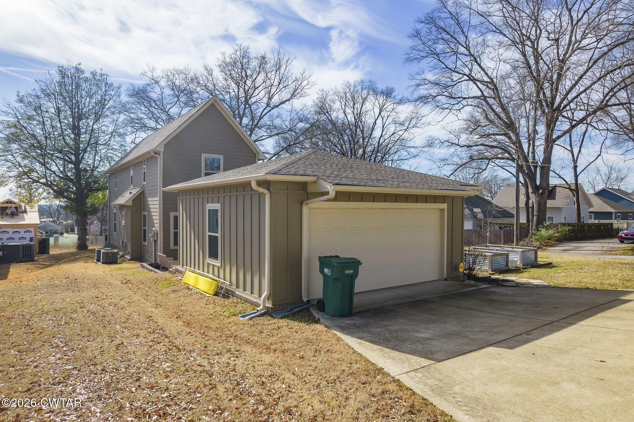 223 Morgan Street Jackson, TN 38301 - Photo 20 of 39 a front view of a house with a yard covered in snow