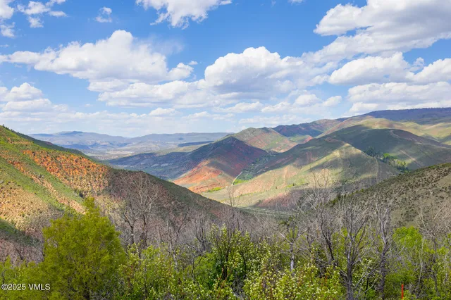 a view of a lake with a yard