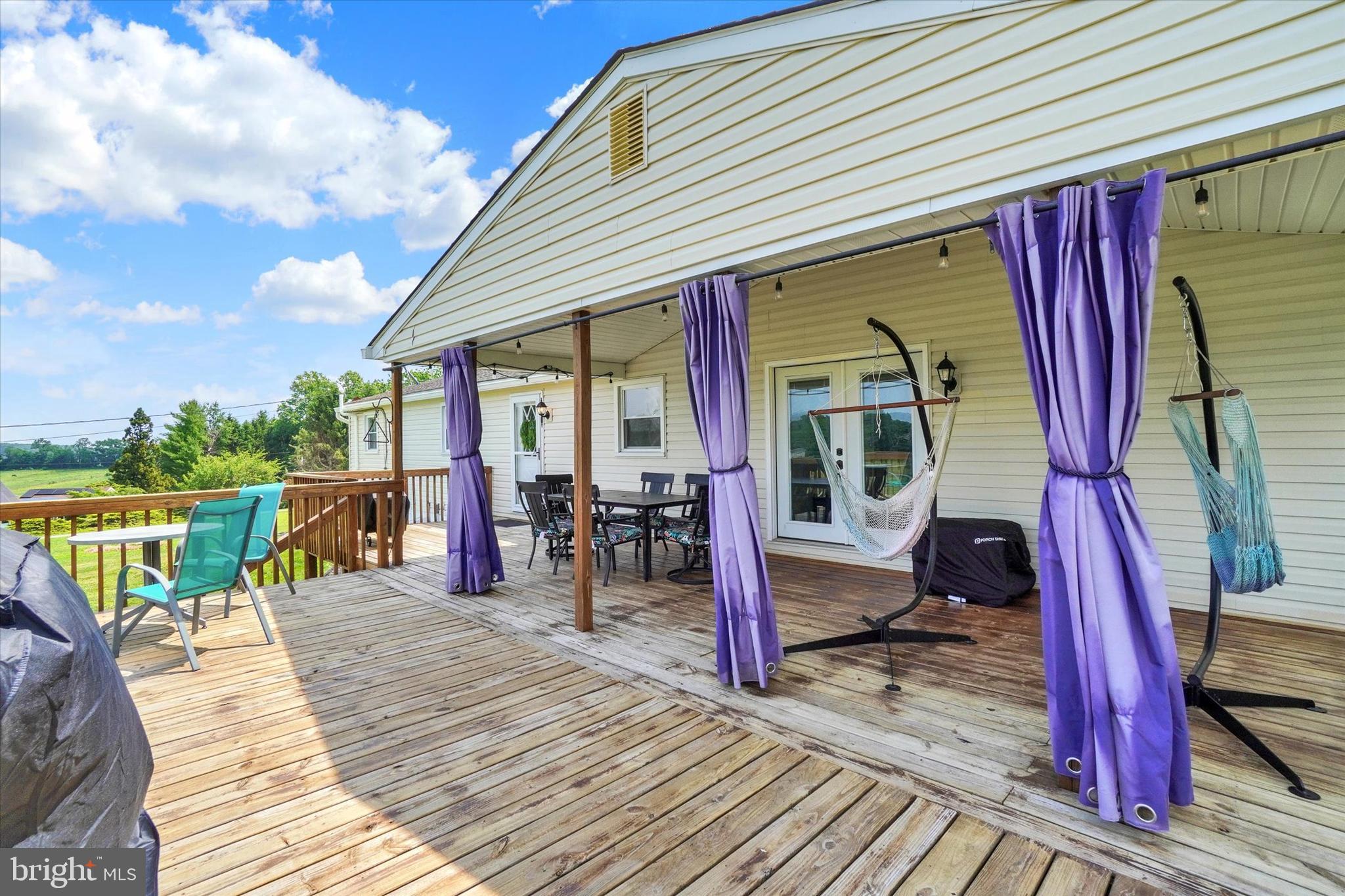 13174 Mont Road Felton, PA 17322 - Photo 10 of 39 a view of a balcony with chairs and wooden floor
