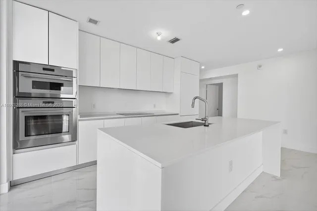 a view of a kitchen with a sink