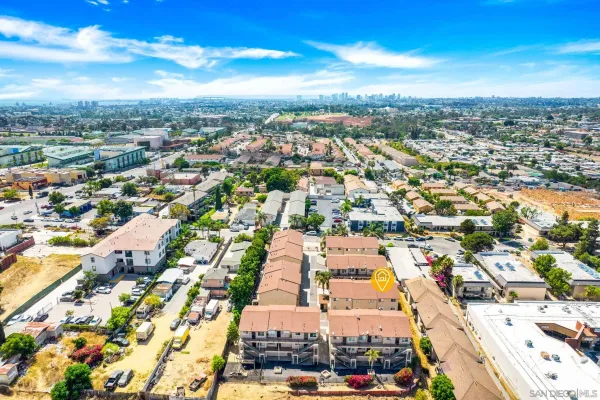 an aerial view of residential houses with outdoor space