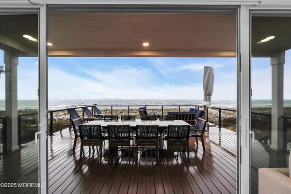 a view of a dinning room with furniture and wooden floor