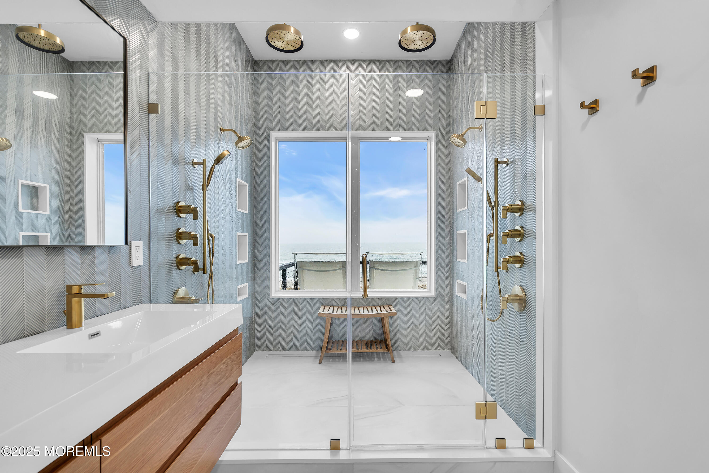 3580 Ocean Terrace Lavallette, NJ 08735 - Photo 24 of 51 a large white kitchen with a large window and stainless steel appliances