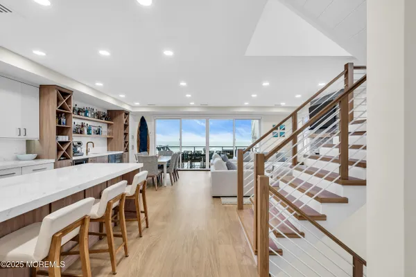 a view of a kitchen with dining table and chairs