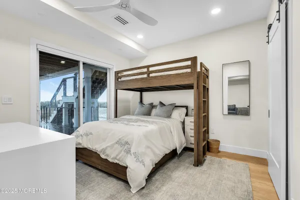 a bedroom with two beds and a chandelier