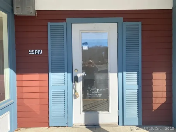 a view of a door and brick wall