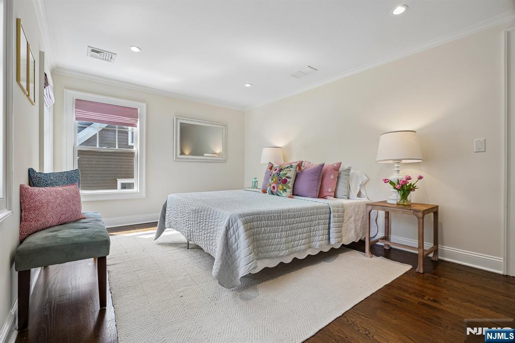 11 Mt Vernon Road Montclair, NJ 07043 - Photo 27 of 49 a bedroom with a bed and wooden floor