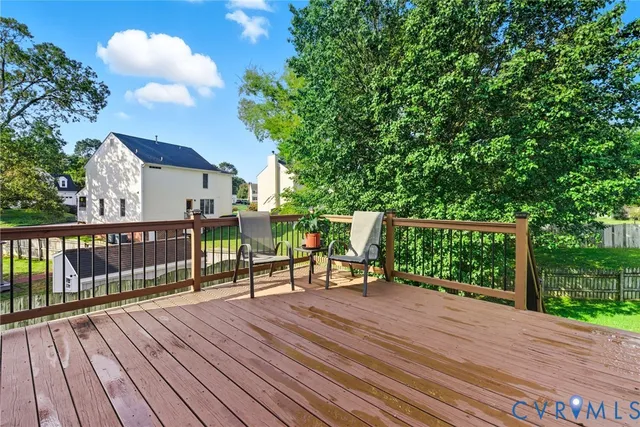 a view of balcony with deck and wooden floor