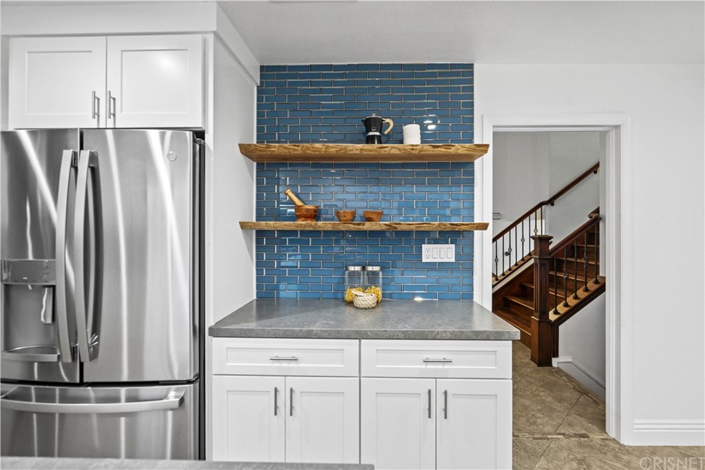 24609 Skyridge Drive Newhall, CA 91321 - Photo 13 of 60 a view of kitchen with stainless steel appliances granite countertop refrigerator and stove