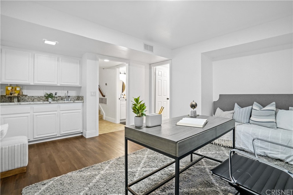 24609 Skyridge Drive Newhall, CA 91321 - Photo 19 of 60 a living room with furniture and wooden floor