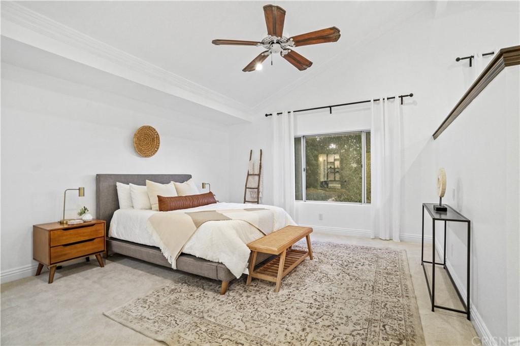 24609 Skyridge Drive Newhall, CA 91321 - Photo 20 of 60 a bedroom with a bed lamp and a window