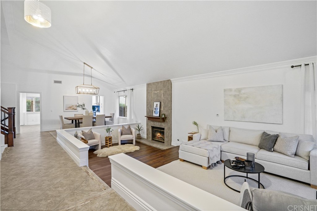 24609 Skyridge Drive Newhall, CA 91321 - Photo 3 of 60 a living room with furniture and a fireplace