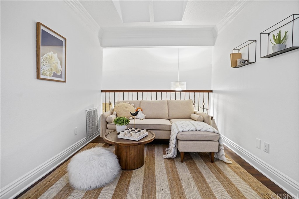 24609 Skyridge Drive Newhall, CA 91321 - Photo 32 of 60 a living room with furniture and wooden floor