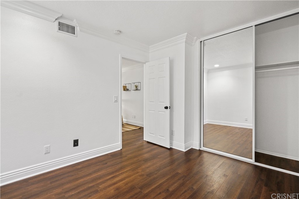 24609 Skyridge Drive Newhall, CA 91321 - Photo 35 of 60 a view of an empty room with wooden floor