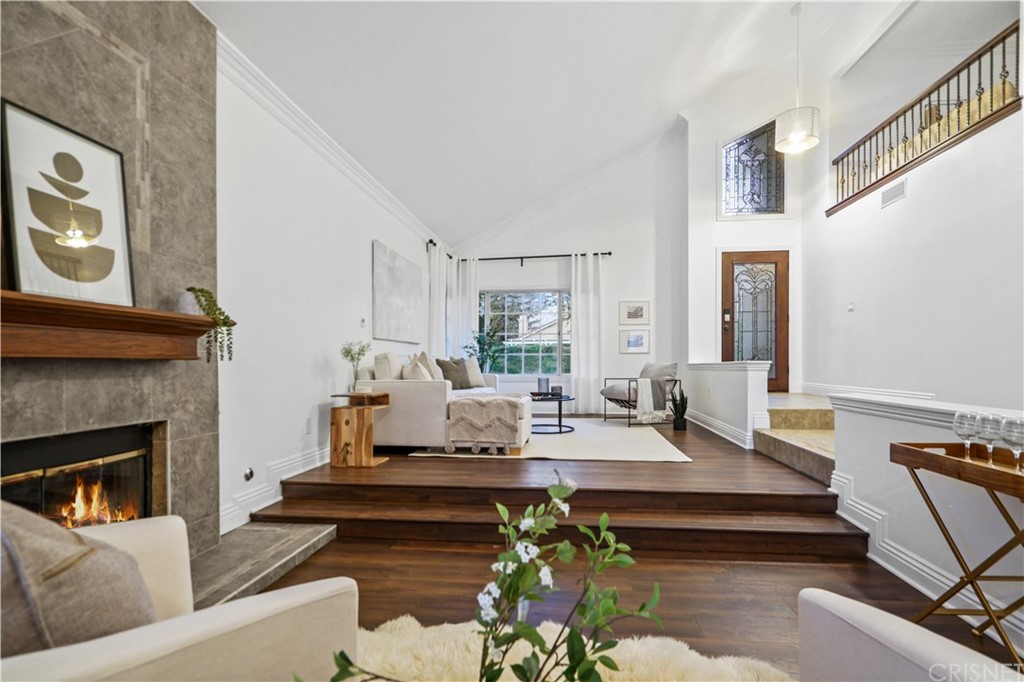 24609 Skyridge Drive Newhall, CA 91321 - Photo 5 of 60 a living room with furniture and a fireplace