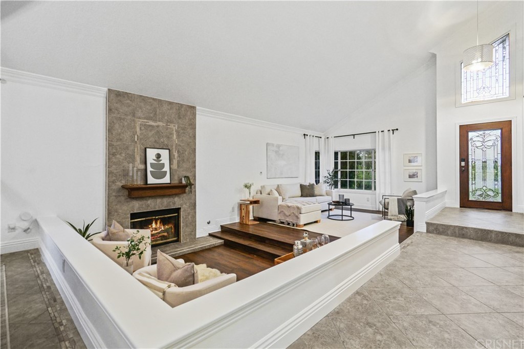 24609 Skyridge Drive Newhall, CA 91321 - Photo 6 of 60 a living room with furniture and a fireplace