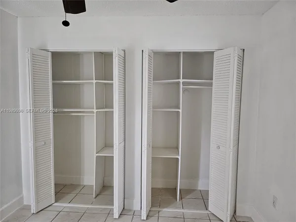 a view of an empty walk in closet