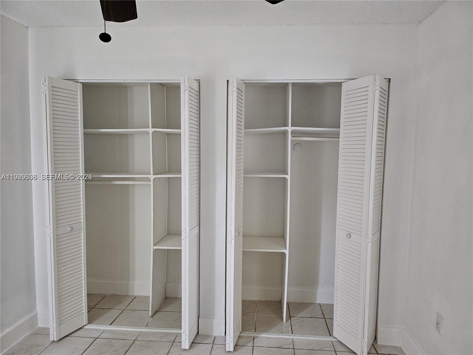 10641 Southwest 108th Avenue, Unit 1H Miami, FL 33176 - Photo 17 of 22 a view of an empty walk in closet
