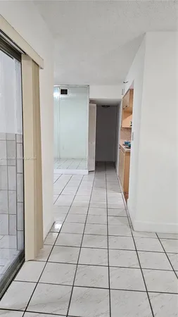 a view of a utility room with windows