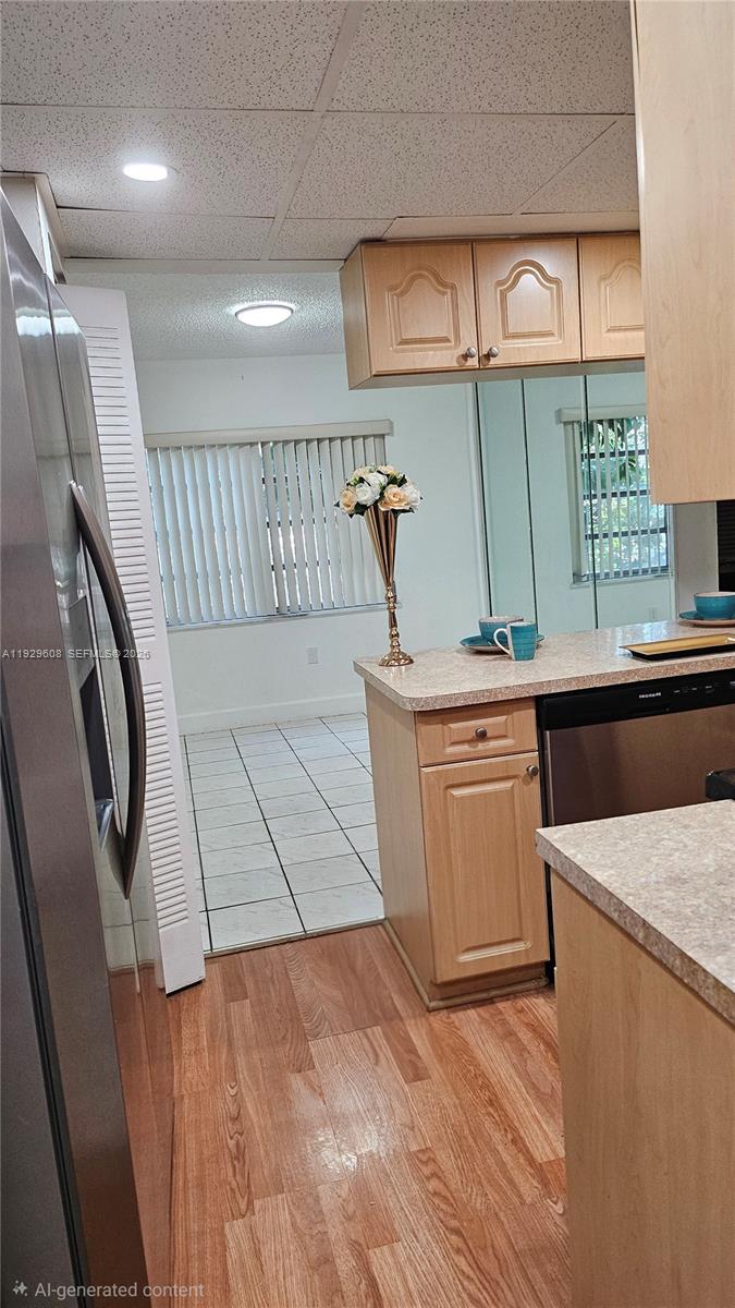 10641 Southwest 108th Avenue, Unit 1H Miami, FL 33176 - Photo 8 of 22 a kitchen with a sink stove and cabinets