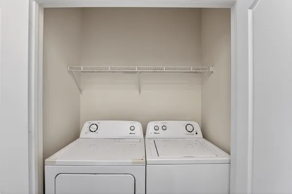 a utility room with dryer and washer