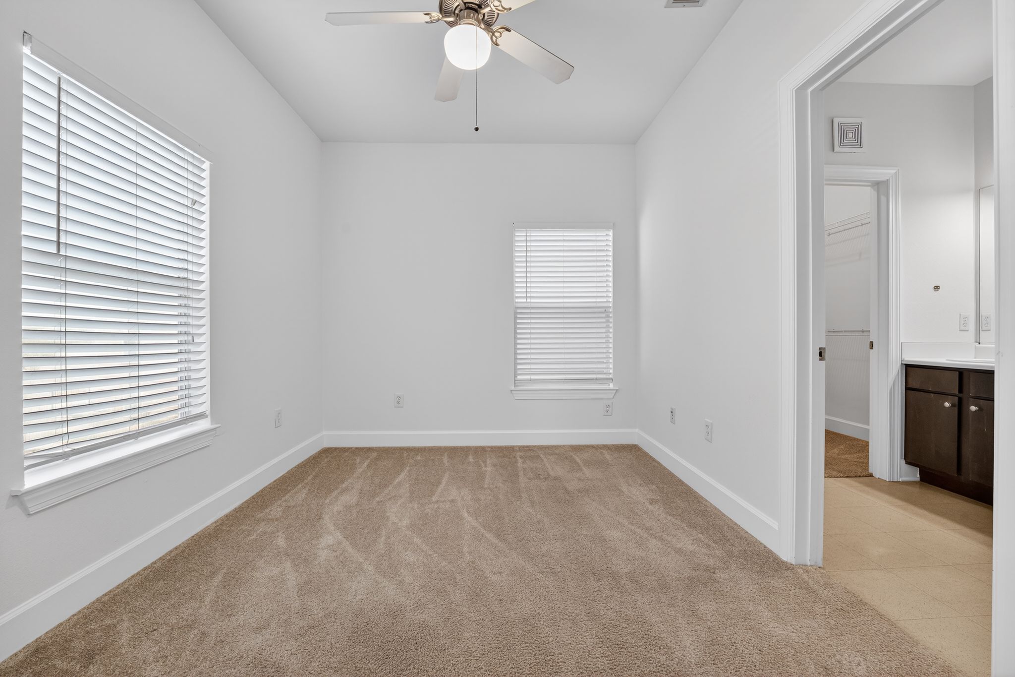 1901 Crossing Place, Unit 2201A Austin, TX 78741 - Photo 14 of 23 wooden floor in an empty room with a window