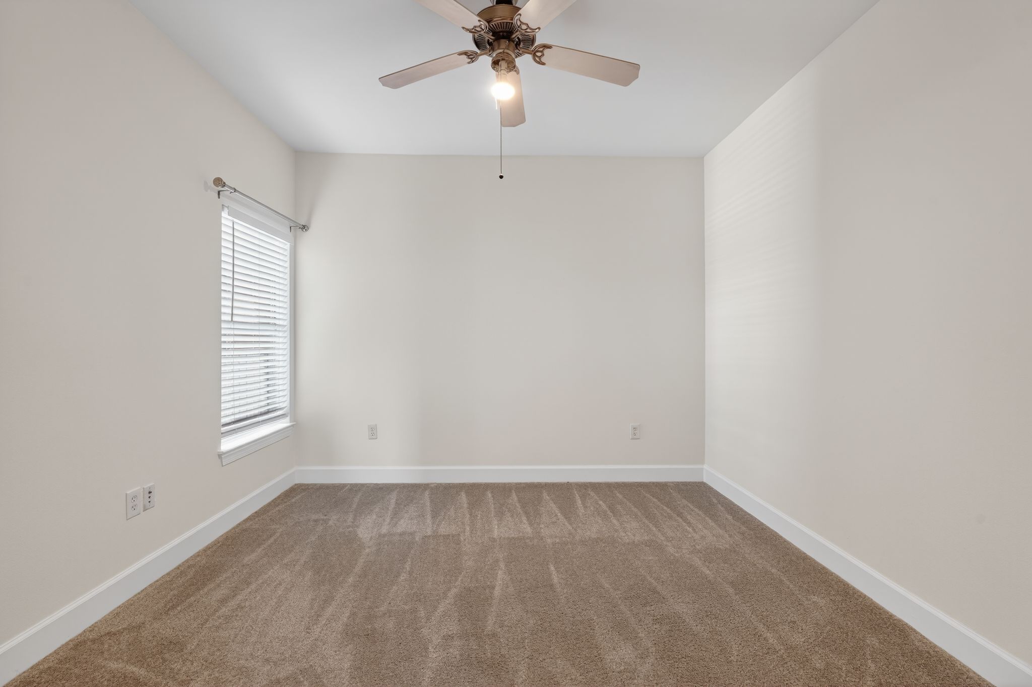 1901 Crossing Place, Unit 2201A Austin, TX 78741 - Photo 15 of 23 an empty room with a window and a fan