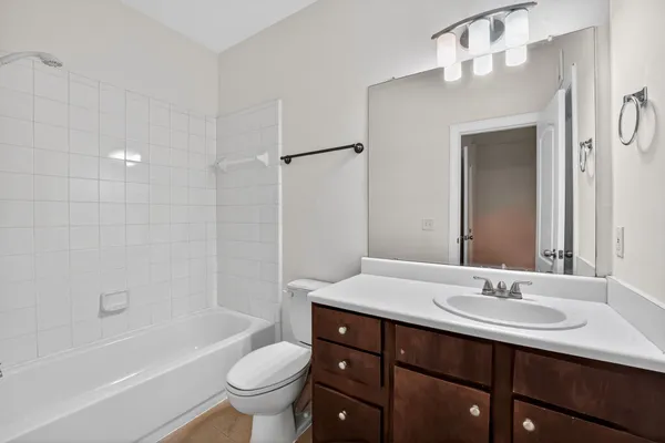 a bathroom with a sink a toilet and a bathtub