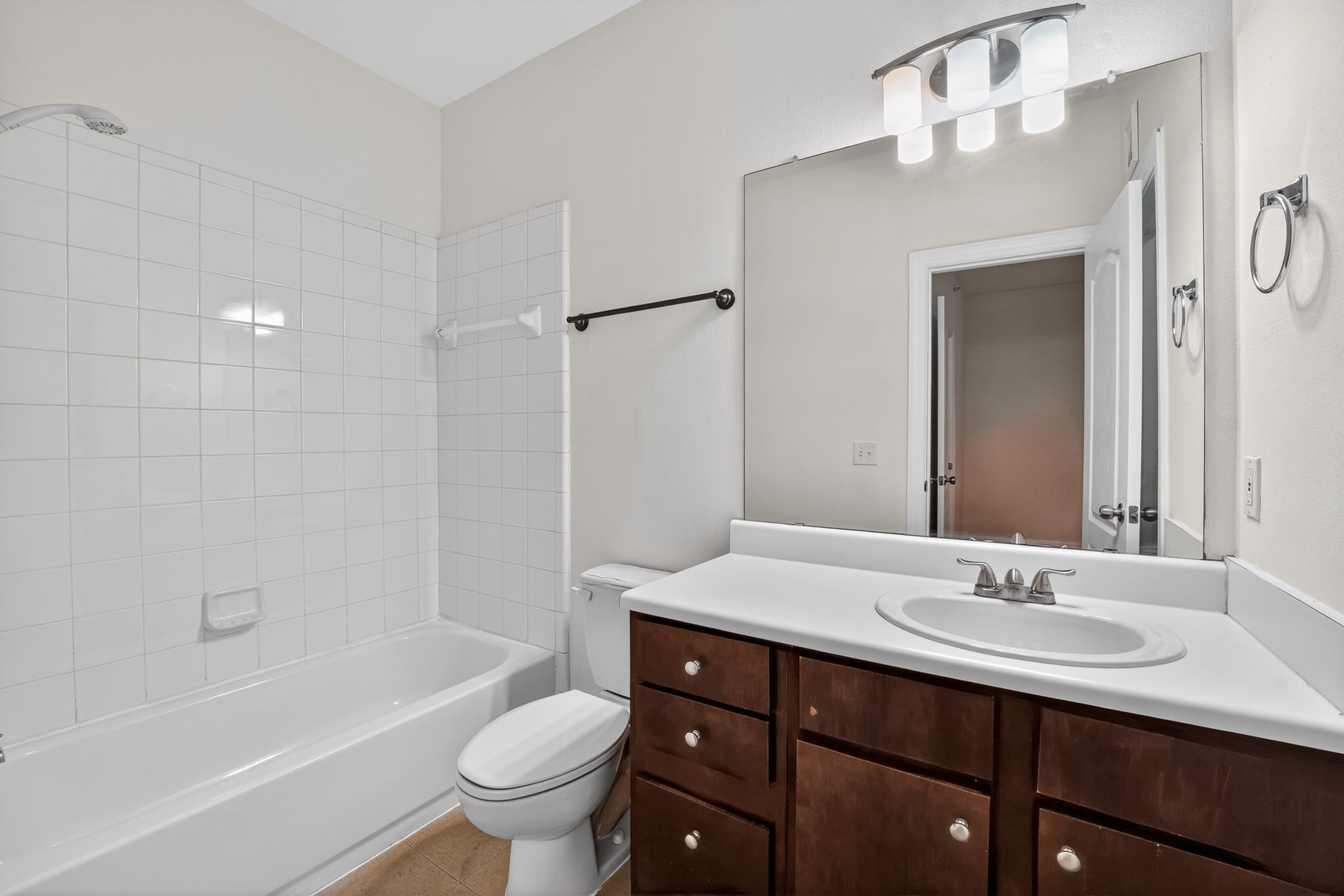 1901 Crossing Place, Unit 2201A Austin, TX 78741 - Photo 16 of 23 a bathroom with a sink a toilet and a bathtub