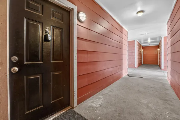 a view of a hallway with some storage area