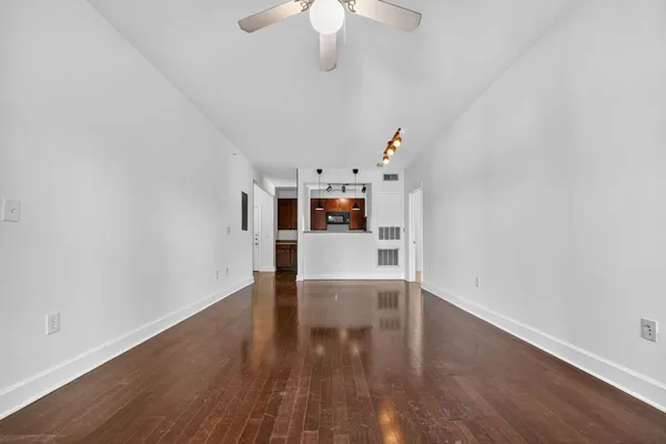 a view of a livingroom with wooden floor