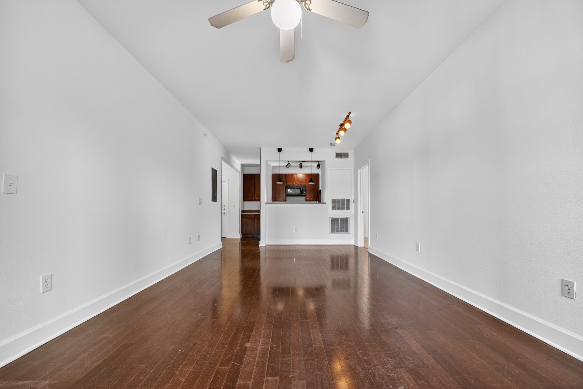 1901 Crossing Place, Unit 2201A Austin, TX 78741 - Photo 4 of 23 a view of a livingroom with wooden floor