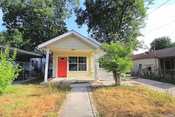 a front view of a house with a yard outdoor seating and yard