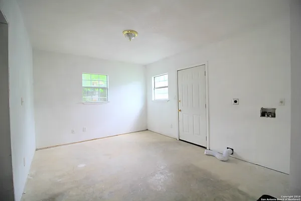 an empty room with windows