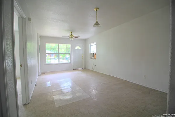 a view of an empty room with a window