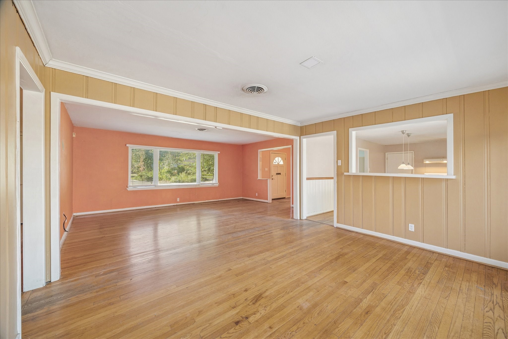 8419 Bluegate Court Houston, TX 77025 - Photo 3 of 12 wooden floor in an empty room with a window