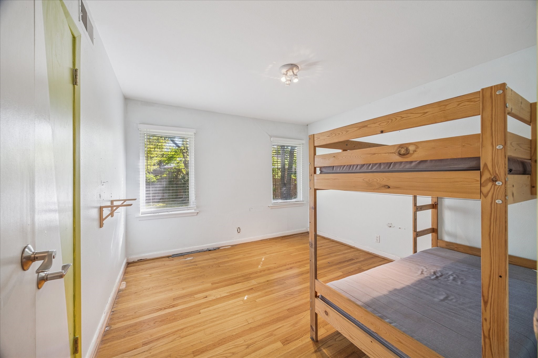 8419 Bluegate Court Houston, TX 77025 - Photo 9 of 12 a view of a room with wooden floor and window