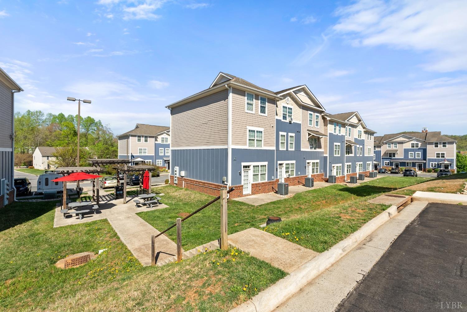 1600 Wards Ferry Road, Unit 706 Lynchburg, VA 24502 - Photo 43 of 49 a view of a house with a swimming pool and a yard