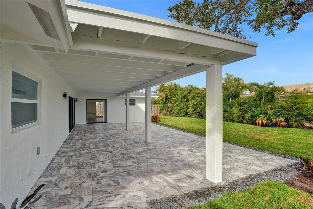 17702 Raintree Terrace Boca Raton, FL 33487 - Photo 17 of 67 a view of a house with backyard and garden