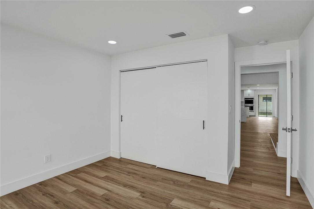 17702 Raintree Terrace Boca Raton, FL 33487 - Photo 54 of 67 a view of empty room with wooden floor