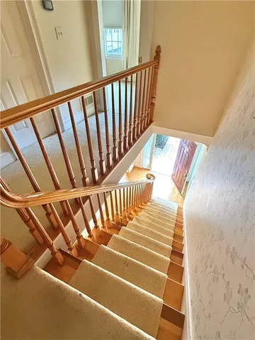 a view of entryway with wooden floor