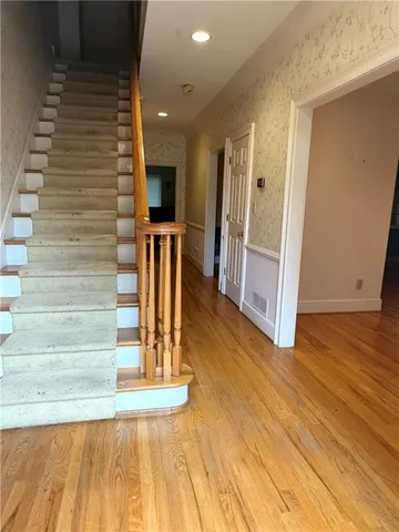 a view of entryway with wooden floor