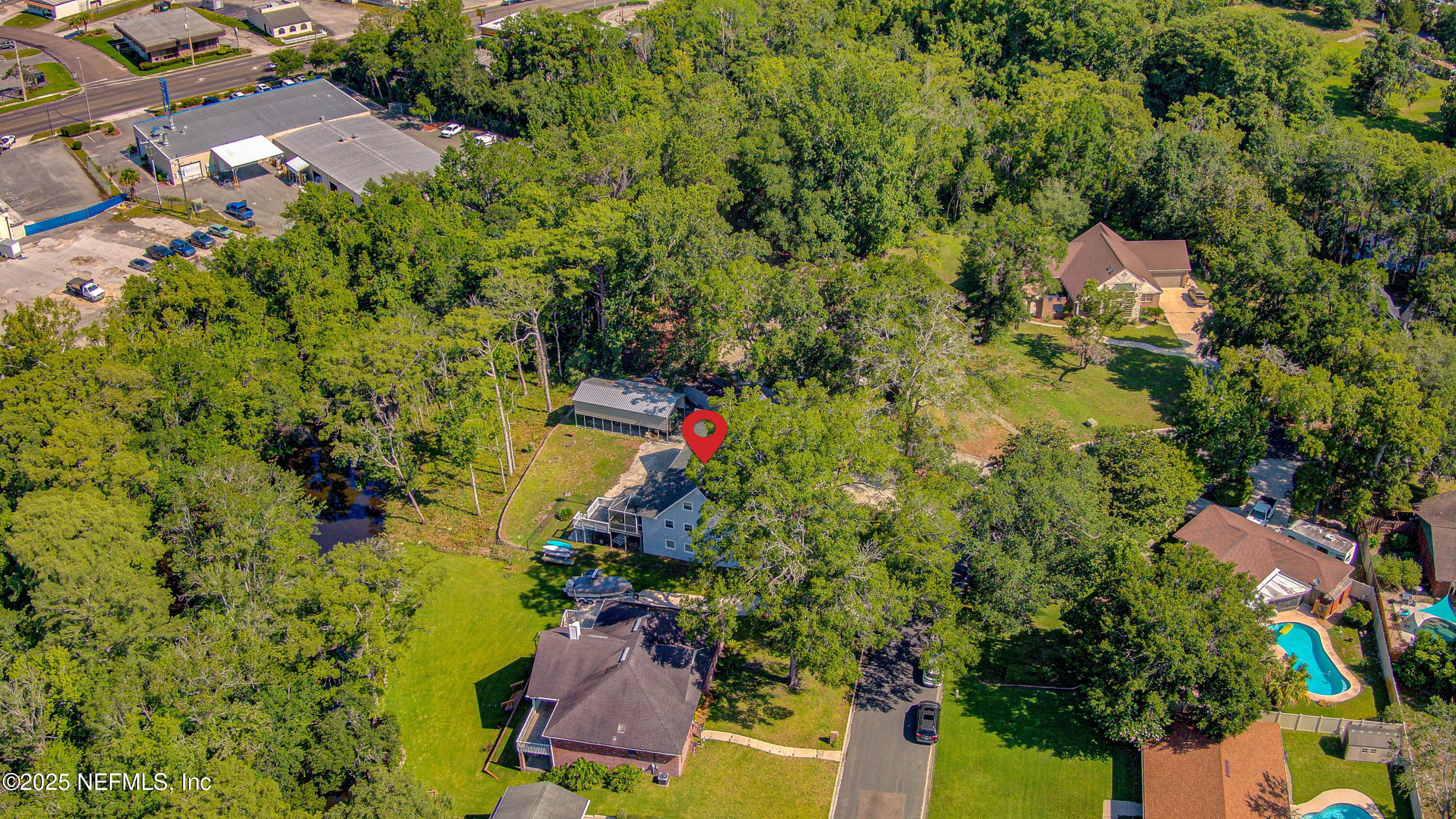 4302 Buck Point Road Jacksonville, FL 32210 - Photo 11 of 74 an aerial view of residential house with outdoor space and trees all around