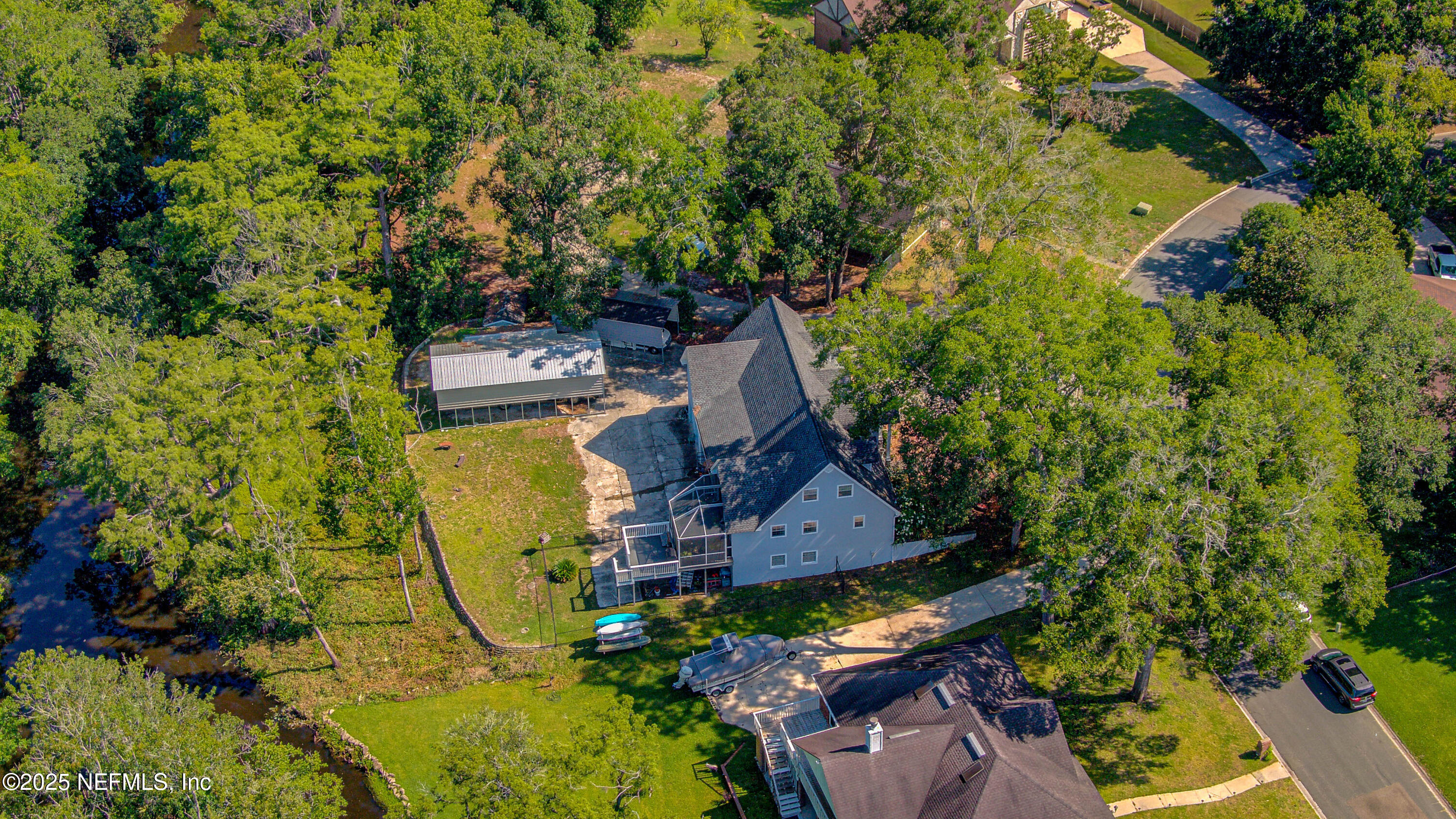 4302 Buck Point Road Jacksonville, FL 32210 - Photo 12 of 74 an aerial view of a house with swimming pool