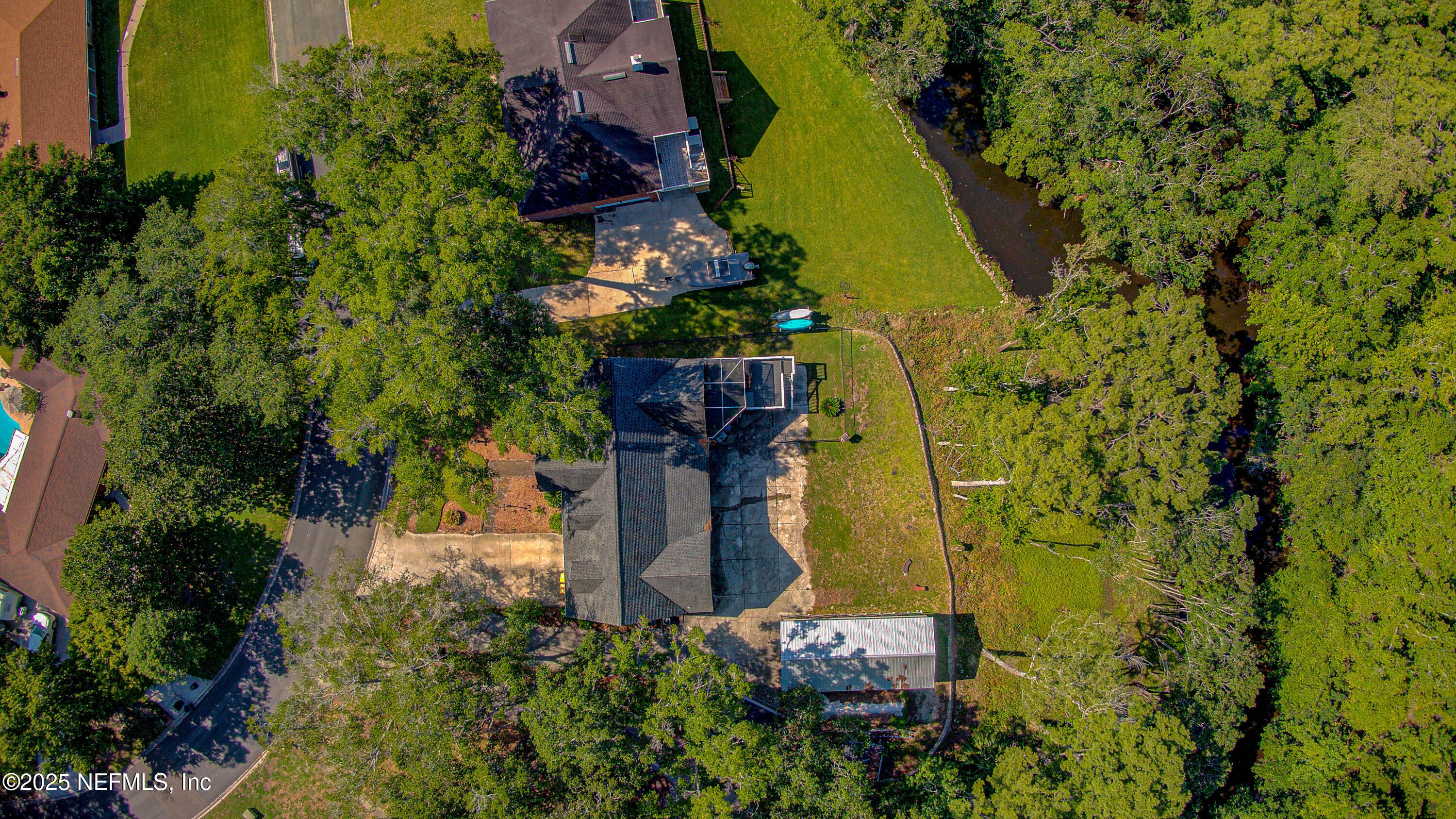 4302 Buck Point Road Jacksonville, FL 32210 - Photo 16 of 74 an aerial view of a house with swimming pool and garden space